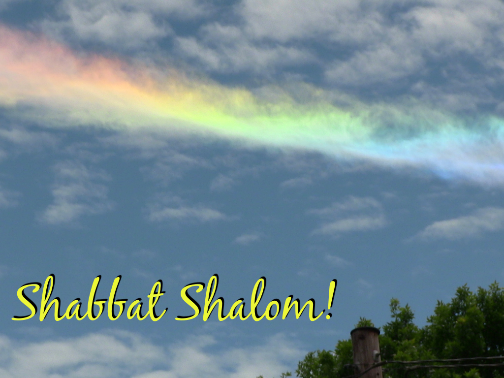 Here's a photo I snapped in front of my house this summer of a beautiful rainbow cloud (the technical term is a "horizontal arc").