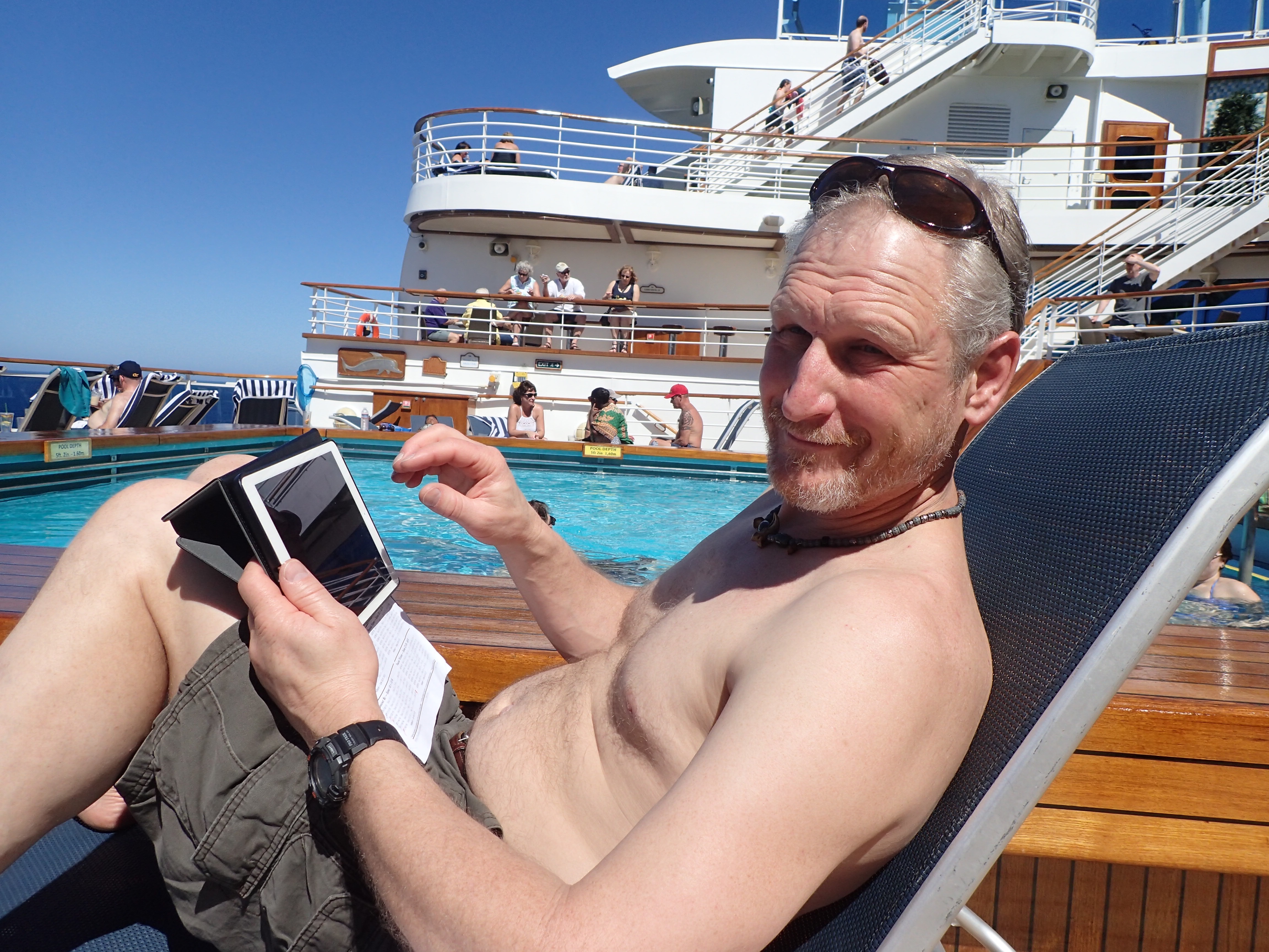 Sandi snapped this photo of me back on the ship. Yes, I'm reading my daily Scripture reading on my iPad! You can actually see the Hoshana Rabbah printed reading schedule underneath the iPad in my lap.